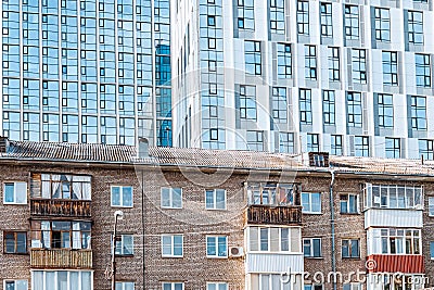 Old and new residential buildings as example of social stratification between rich and poor Stock Photo