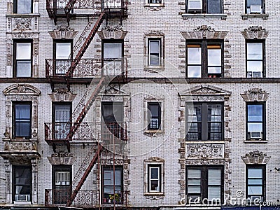 Old New York apartment building with external fire escapes, Stock Photo