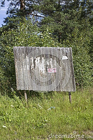 Askew old notice-board Stock Photo