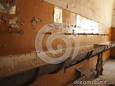 Old, obsolete and dirty bathroom Stock Photo