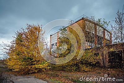 Old obsolete ruined concrete industrial building. Abandoned factory Stock Photo