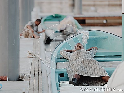Omani Men sleeping in Boat Editorial Stock Photo