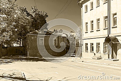 An old one-story house with a sign `Metal repair` Editorial Stock Photo