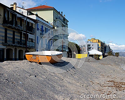 Old orange boat on the beach in ligurian sea Editorial Stock Photo