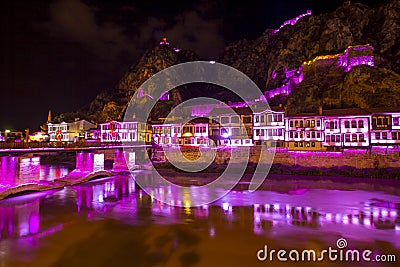 Old Ottoman houses evening colorful lights view by the Yesilirmak River in Amasya City. Amasya is populer tourist destination in a Editorial Stock Photo