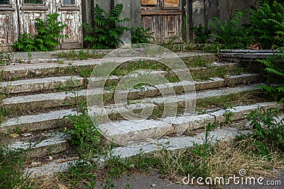 Old overgrown with destroyed stone balustrades old antique steps of a stone staircase. Ruined stairs. The dilapidated building, Stock Photo