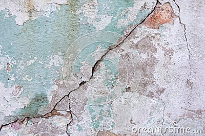 Old painted wall. Green and pink damage surface. Peeling paint background. Stone demaged backdrop. Stock Photo