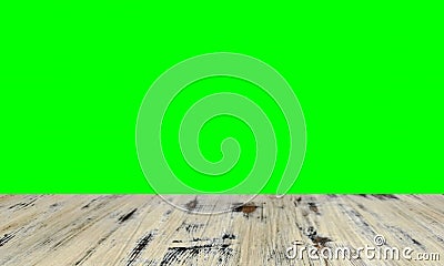 Old painted washed oak wood table on the blurry chroma key green screen wall background, wooden table Stock Photo