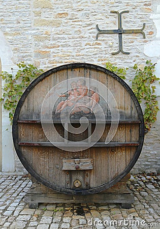 An old painted wine barrel in Chateau de Pommard in Burgundy, France Editorial Stock Photo