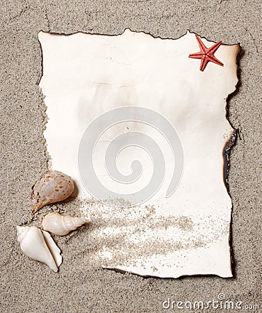 Old paper tag on natural sand with seashell Stock Photo