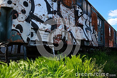 Old train in the depot covered in graffiti Stock Photo