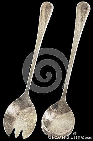 Old Patinated Stainless Steel Salad Fork And Spoon Isolated On Black Background Stock Photo