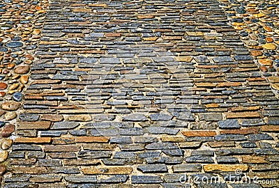 Old pavement from colored stones. Abstract background or texture Stock Photo