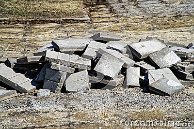 Old paving tiles, removed from the city street during repair. Reconstruction Stock Photo