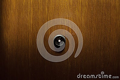 Peephole in wooden doors Stock Photo