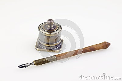 Old pen and antique metallic inkwell Stock Photo