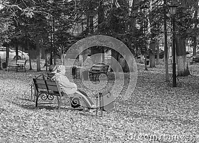 Old people on a bench in the Park Editorial Stock Photo