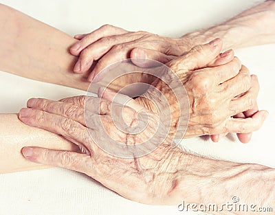 Old people holding hands. Closeup. Stock Photo