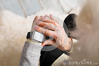 Old person using smart watch Stock Photo