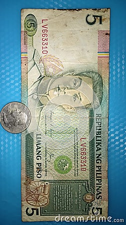 Old philippine five peso 1989 and old us coin dollar 1949 Stock Photo