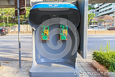 An old Phone booth Located on the sidewalk. Editorial Stock Photo
