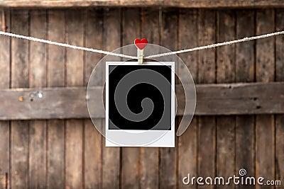 Old picture frame hanging on the clothesline Stock Photo