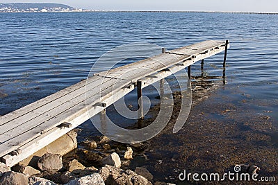 Old pier in Bouzigues harbor Stock Photo
