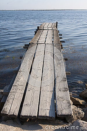 Old pier in Bouzigues harbor Stock Photo