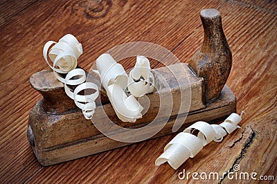 Old plane with wood shavings Stock Photo