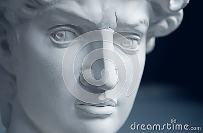 An Old Plaster Sculpture Of A Man On The Table Stock Photo