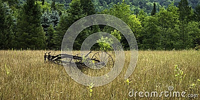 Old Antique Plow in Country Field Stock Photo