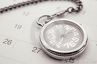 Old pocket watch on calendar page. vintage, black&white Stock Photo