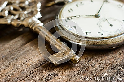 Old pocket watch and chain, vintage locket watch with retro key Stock Photo