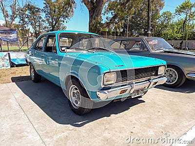 Old popular blue 1970s Dodge 1500 four-door sedan car by Chrysler Argentina in a park. Editorial Stock Photo