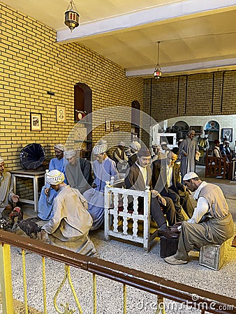 An old popular coffee shop serving tea to customers in the old city of Baghdad Editorial Stock Photo