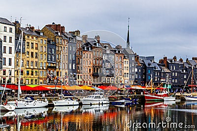 Colorful bulding and waterfront of Honfleur harbor in Normandy, France. Editorial Stock Photo