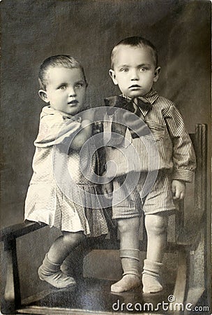 Old Portrait of Two Twin Children Stock Photo