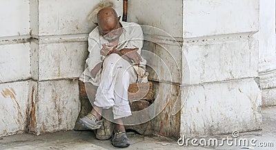 Old poverty stricken man sleeping Editorial Stock Photo