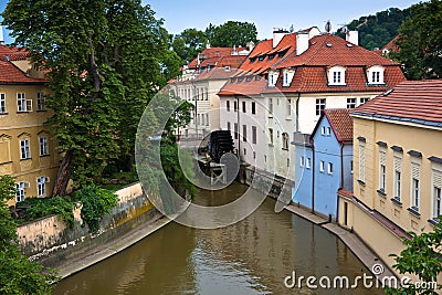 Old Prague waternill wheel on Chertovka river Stock Photo