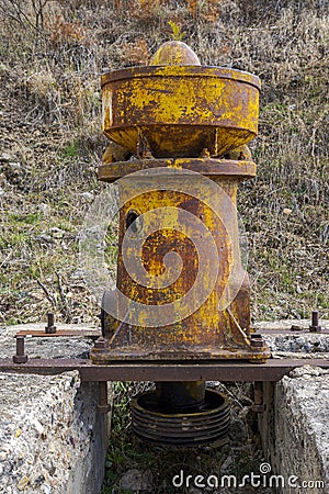 Old primary gyratory crusher in an abandoned mine Stock Photo