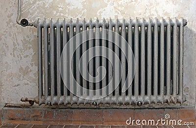 Old radiator in an empty historic home Stock Photo