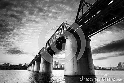 Old railroad bridge crossing the river Stock Photo