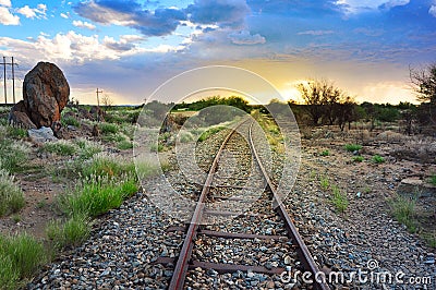 Old railway through the African semi desert landscape Stock Photo