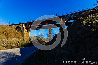 Old railway bridge used in mountains. Spring landscape Stock Photo