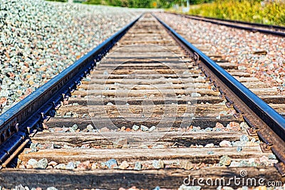 Old railway sleepers and rails in an American town Stock Photo