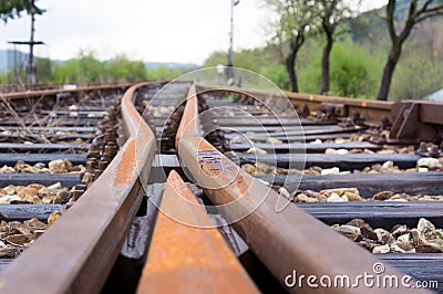 Old railway tracks at a junction Stock Photo