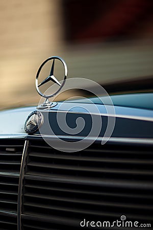 Old rare vintage green Mercedes-Benz hood, badge, radiator grille on blurred background. Editorial use only. Editorial Stock Photo