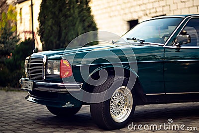 Old rare vintage green Mercedes-Benz hood, wheels, door, windshield, mirror, badge, glasses, headlights, radiator grille Editorial Stock Photo