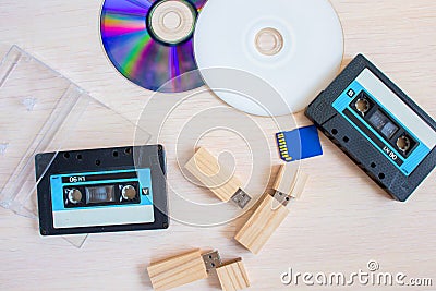 Old recorder cartridge, USB stick, and compact disks together Stock Photo