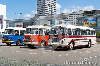 The old red and blue Skoda bus rides through the streets of the Polish capital. Tourist bus vintage model. The street of Editorial Stock Photo